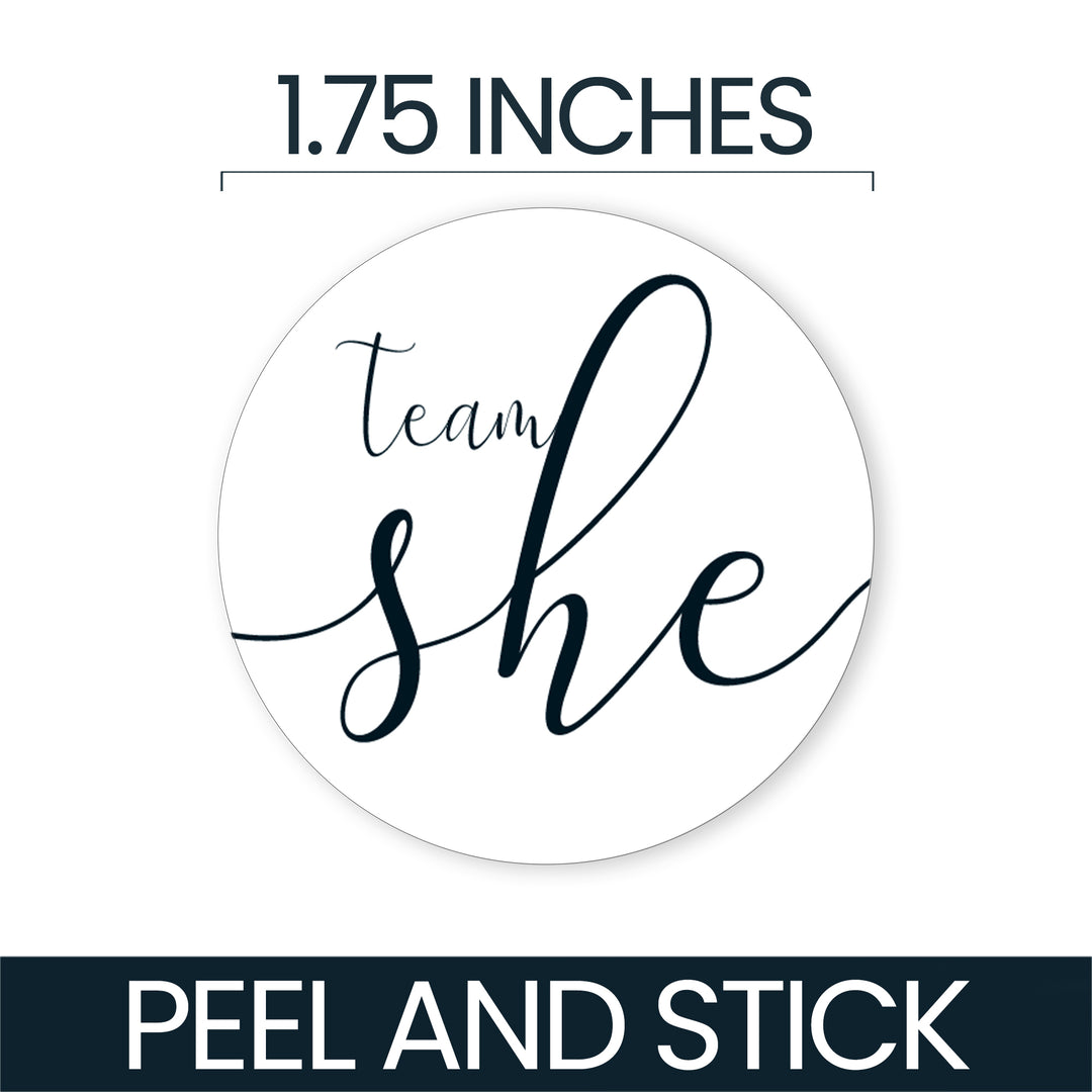A round white peel-and-stick sticker with the phrase 'team she' in dark navy script, shown with text indicating 1.75 inches and 'PEEL AND STICK' on a white background.