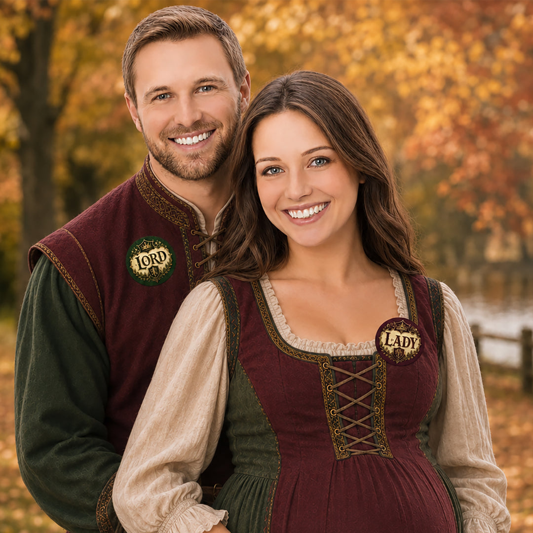 Couple in medieval-style outfits wearing Lord and Lady gender reveal voting stickers at a Renaissance Faire-themed party