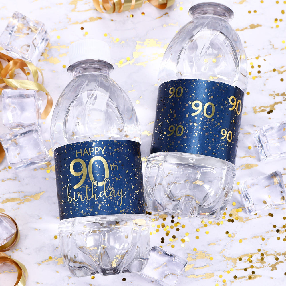 A close-up view of a navy blue water bottle label with gold lettering that reads "Happy 90th Birthday" and features a sleek, modern design
